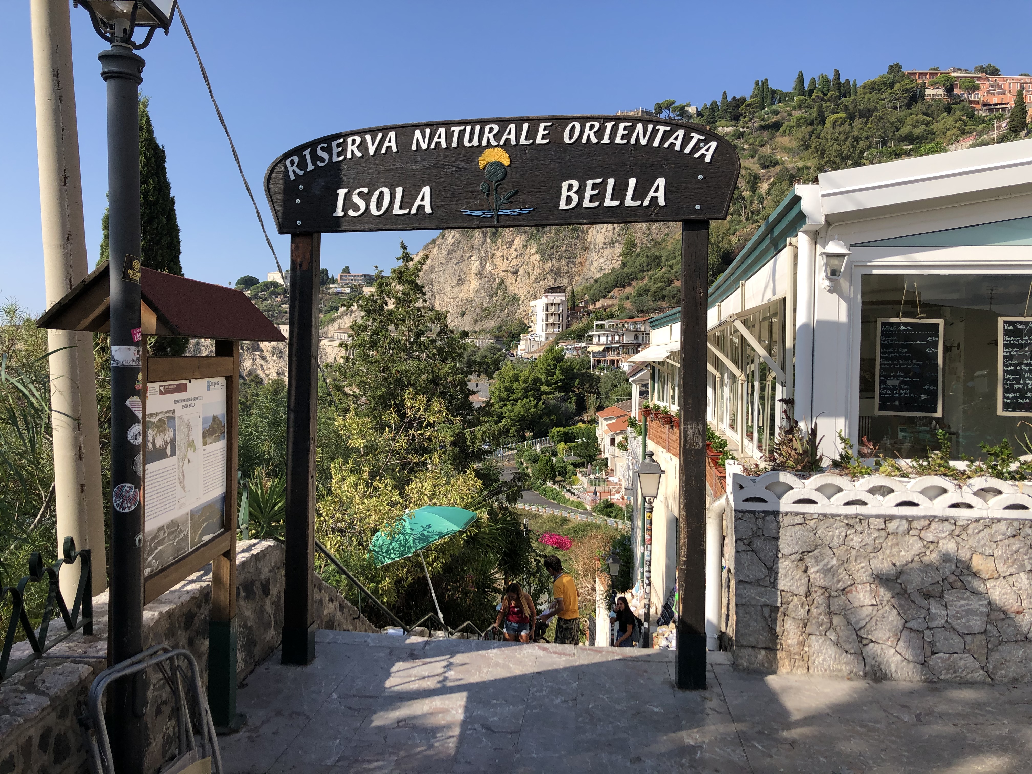 Stone steps down to Isola Bella beach
