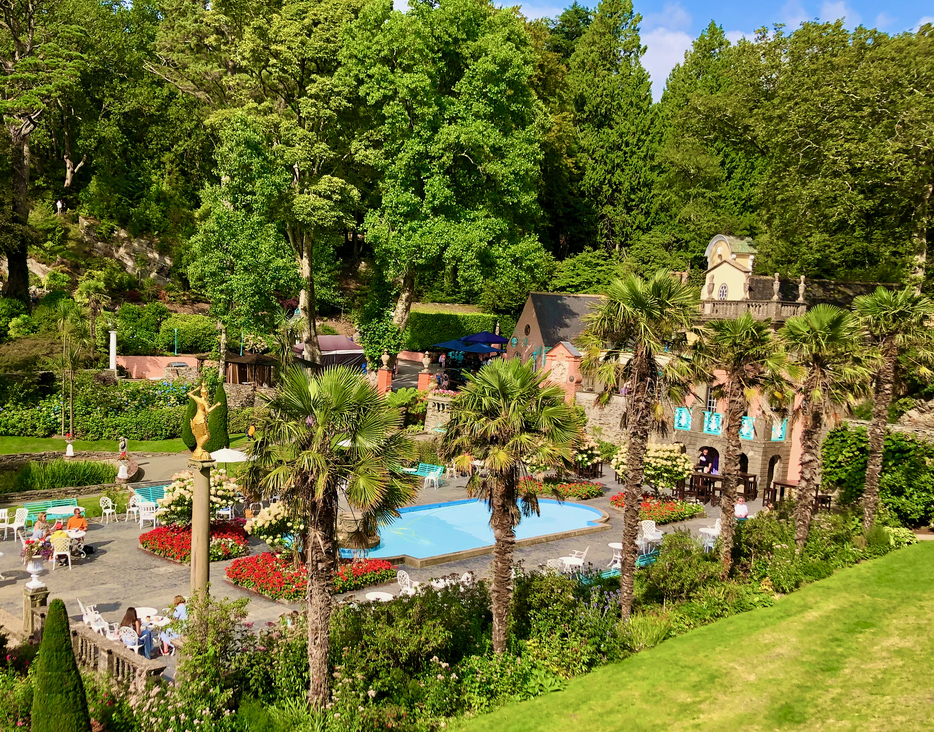 Top to bottom:
A colourful building at Portmeirion
Flowering shrubs
View of the pool