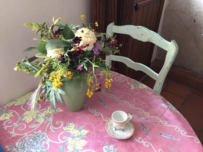 Fresh flowers and heritage cup and saucer