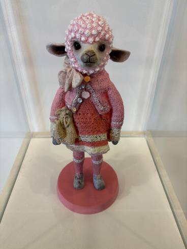 Pretty sheep in the shop baa-ing to be bought